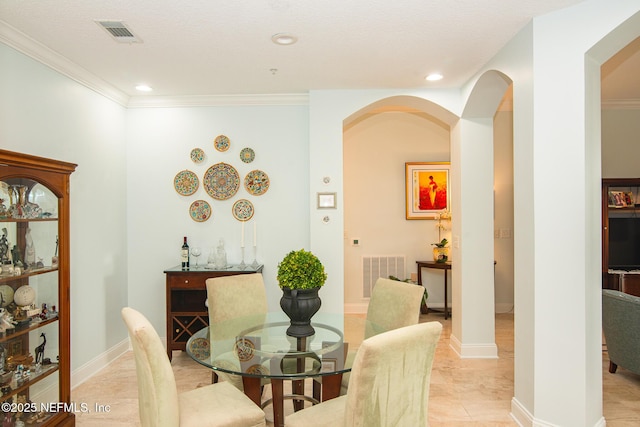 4300 S Beach Pkwy Unit 4306, Jacksonville Beach, FL 32250 - dining area featuring arched walkways, crown molding, recessed lighting, and light tile patterned floors