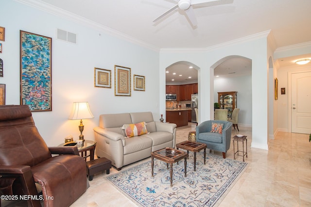 4300 S Beach Pkwy Unit 4306, Jacksonville Beach, FL 32250 - living room featuring arched walkways, ornamental molding, a ceiling fan, and baseboards