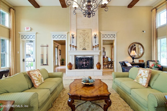 4300 S Beach Pkwy Unit 4306, Jacksonville Beach, FL 32250 - living area with a high ceiling, a chandelier, beamed ceiling, and a fireplace