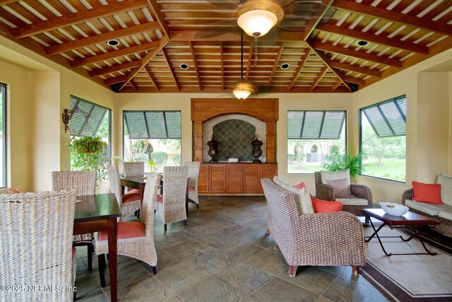 4300 S Beach Pkwy Unit 4306, Jacksonville Beach, FL 32250 - living area with stone tile floors and lofted ceiling