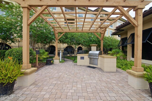 4300 S Beach Pkwy Unit 4306, Jacksonville Beach, FL 32250 - view of patio / terrace with grilling area, fence, exterior kitchen, and a pergola