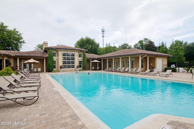 4300 S Beach Pkwy Unit 4306, Jacksonville Beach, FL 32250 - community pool featuring a patio, fence, and french doors
