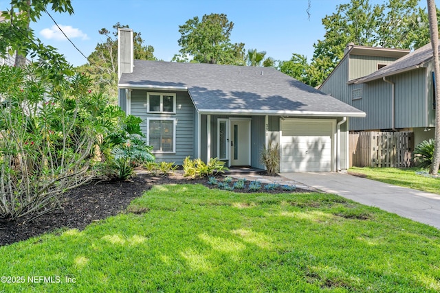 338 Magnolia St, Atlantic Beach, FL 32233 - mid-century inspired home featuring an attached garage, a chimney, driveway, and a shingled roof