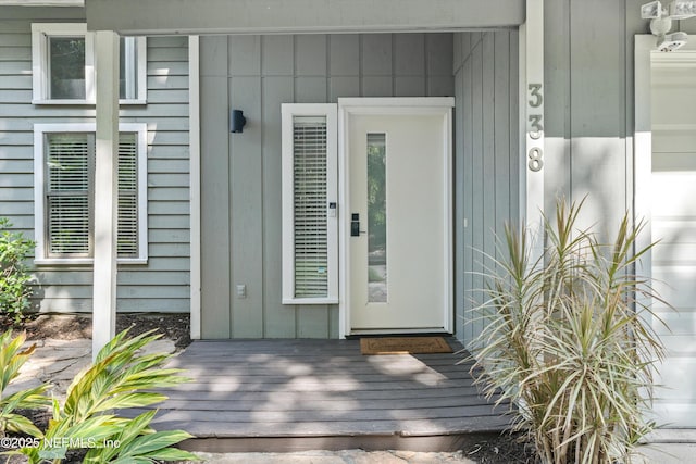 338 Magnolia St, Atlantic Beach, FL 32233 - property entrance featuring board and batten siding