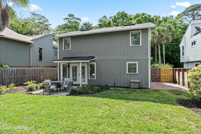 338 Magnolia St, Atlantic Beach, FL 32233 - back of house with french doors, a patio area, a shingled roof, and a gate