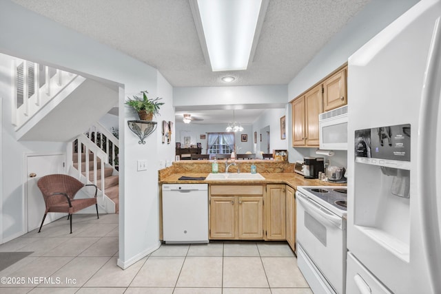 1522 Sand Dollar Cir, Neptune Beach, FL 32266 - kitchen featuring white appliances, light tile patterned floors, a sink, a textured ceiling, and light countertops
