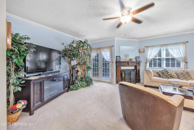 1522 Sand Dollar Cir, Neptune Beach, FL 32266 - carpeted living area with ornamental molding, a textured ceiling, a ceiling fan, french doors, and a tiled fireplace