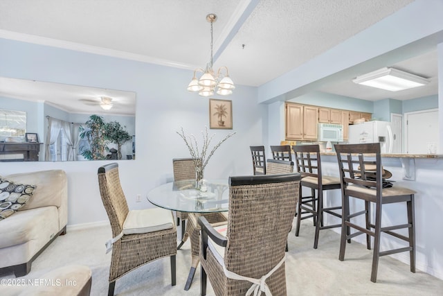 1522 Sand Dollar Cir, Neptune Beach, FL 32266 - dining area featuring light colored carpet, baseboards, ornamental molding, and a textured ceiling