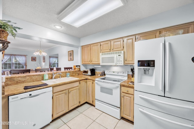 1522 Sand Dollar Cir, Neptune Beach, FL 32266 - kitchen with white appliances, a sink, light tile patterned floors, a textured ceiling, and light countertops