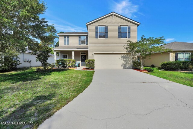 137 Codman Dr, Saint Augustine, FL 32084 - traditional-style house featuring concrete driveway, an attached garage, and a front yard
