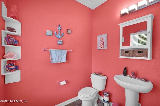 137 Codman Dr, Saint Augustine, FL 32084 - bathroom with toilet, baseboards, and tile patterned flooring