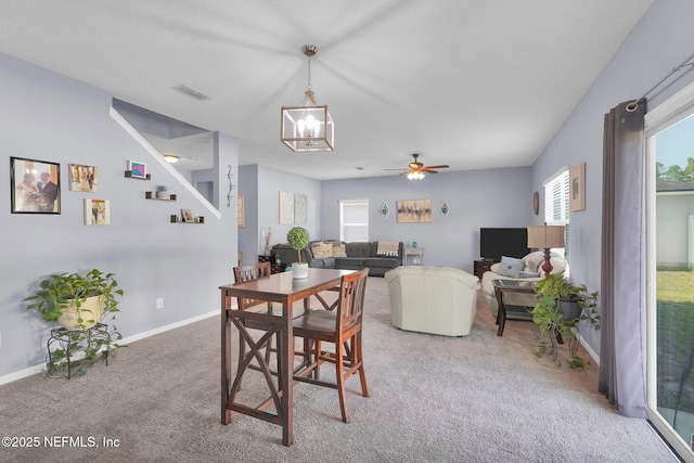 137 Codman Dr, Saint Augustine, FL 32084 - dining area with a chandelier, carpet floors, baseboards, and ceiling fan
