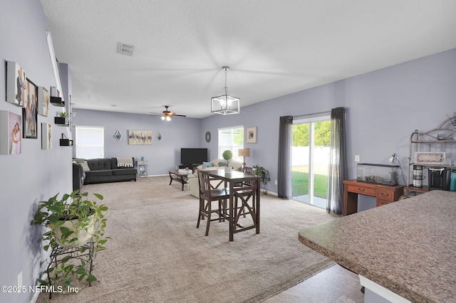 137 Codman Dr, Saint Augustine, FL 32084 - dining room featuring healthy amount of natural light, light carpet, and ceiling fan