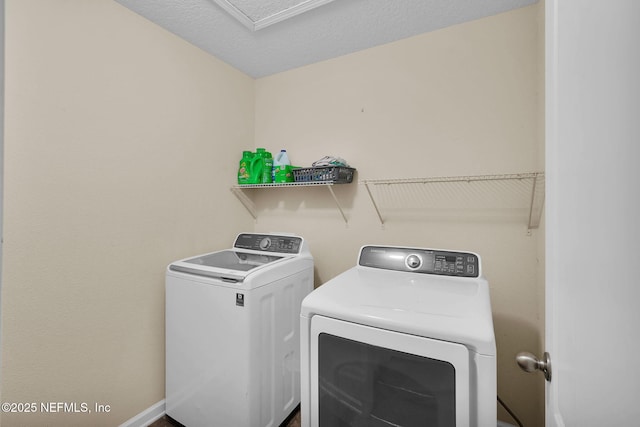137 Codman Dr, Saint Augustine, FL 32084 - laundry area featuring washer and dryer and baseboards