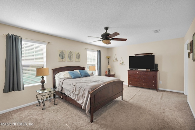 137 Codman Dr, Saint Augustine, FL 32084 - bedroom with carpet flooring, a textured ceiling, a ceiling fan, and baseboards