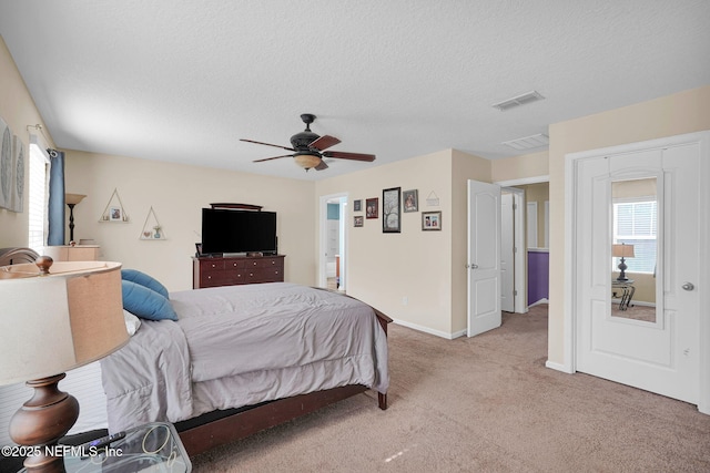 137 Codman Dr, Saint Augustine, FL 32084 - bedroom featuring light colored carpet, a textured ceiling, ceiling fan, and baseboards