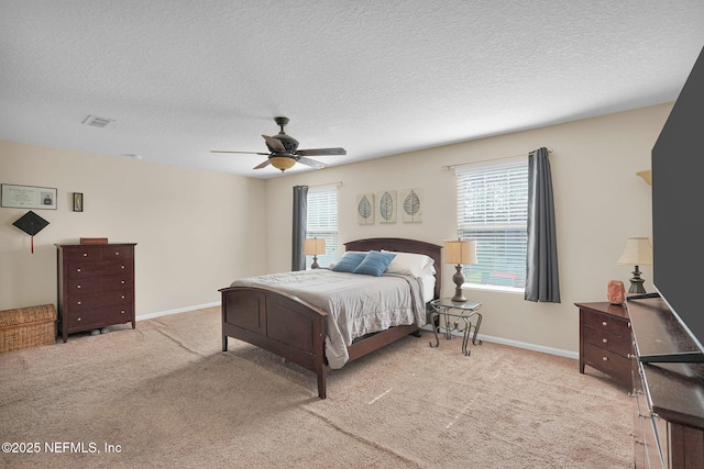 137 Codman Dr, Saint Augustine, FL 32084 - bedroom featuring light carpet, a textured ceiling, a ceiling fan, and baseboards