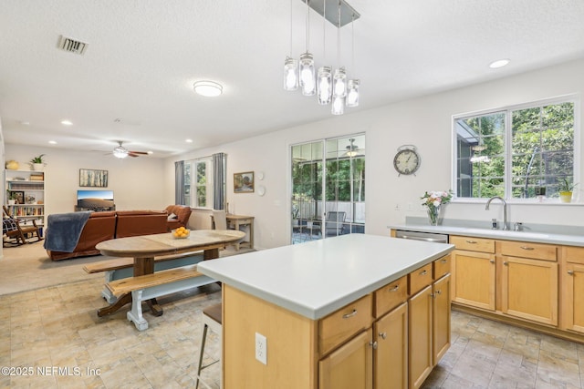 864 Collinswood Dr W, Jacksonville, FL 32225 - kitchen with a sink, ceiling fan, a kitchen island, light countertops, and recessed lighting
