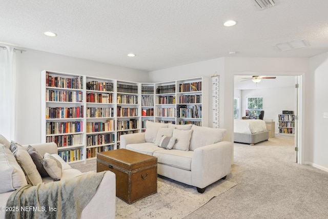 864 Collinswood Dr W, Jacksonville, FL 32225 - carpeted living room with recessed lighting, a ceiling fan, and a textured ceiling