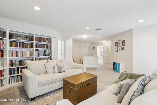 864 Collinswood Dr W, Jacksonville, FL 32225 - carpeted living room with recessed lighting and a textured ceiling