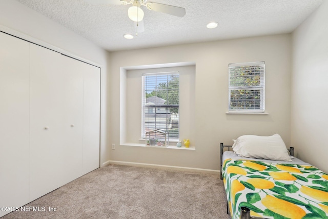864 Collinswood Dr W, Jacksonville, FL 32225 - carpeted bedroom featuring a textured ceiling, a closet, recessed lighting, ceiling fan, and baseboards