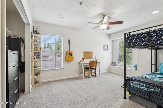 864 Collinswood Dr W, Jacksonville, FL 32225 - carpeted bedroom with baseboards, a textured ceiling, an office area, and ceiling fan