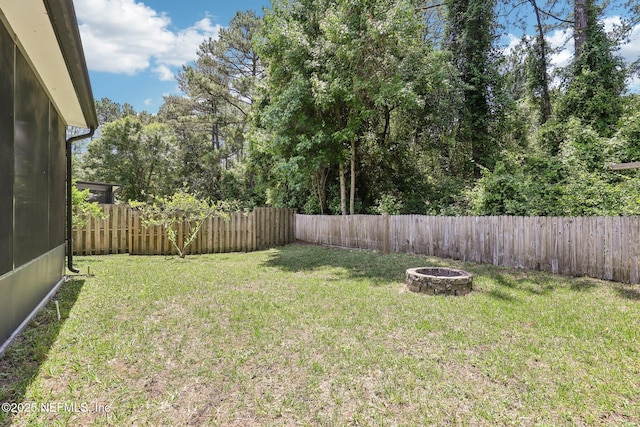 864 Collinswood Dr W, Jacksonville, FL 32225 - view of yard with an outdoor fire pit