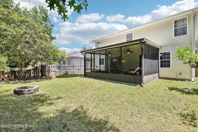 864 Collinswood Dr W, Jacksonville, FL 32225 - view of yard with a sunroom, a fire pit, a trampoline, and ceiling fan
