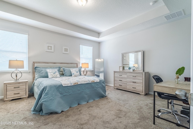 497 Convex Ln, Saint Augustine, FL 32095 - carpeted bedroom with an office area, baseboards, and a tray ceiling