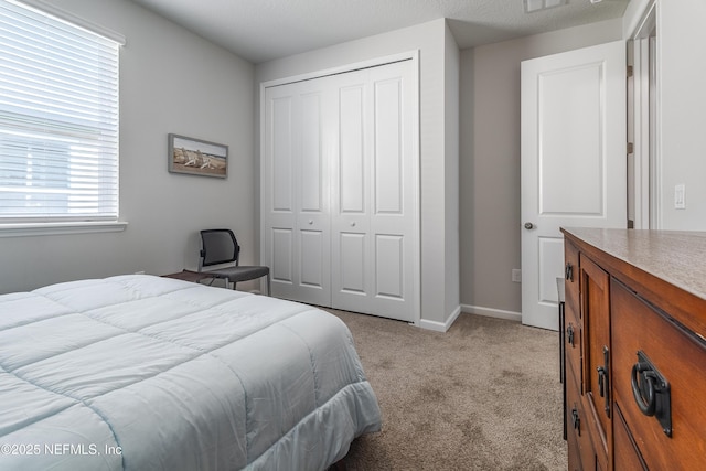 497 Convex Ln, Saint Augustine, FL 32095 - bedroom featuring a closet, light carpet, and baseboards