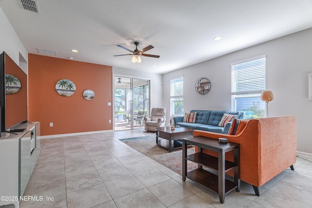 497 Convex Ln, Saint Augustine, FL 32095 - living area featuring a ceiling fan, recessed lighting, baseboards, light tile patterned floors, and a textured ceiling