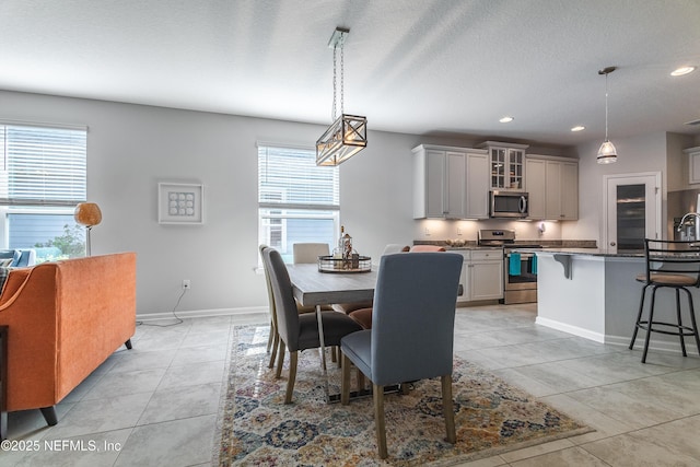 497 Convex Ln, Saint Augustine, FL 32095 - dining space featuring healthy amount of natural light, baseboards, light tile patterned flooring, recessed lighting, and a textured ceiling