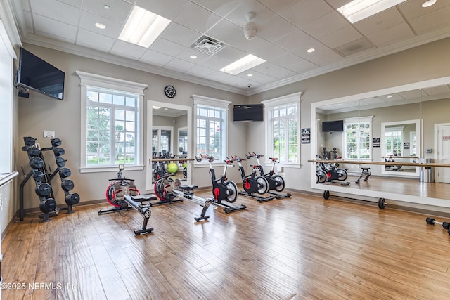 497 Convex Ln, Saint Augustine, FL 32095 - gym featuring wood finished floors, crown molding, and baseboards