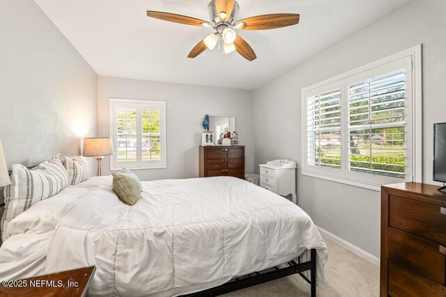 6500 Altama Rd, Jacksonville, FL 32216 - bedroom with light colored carpet, baseboards, and ceiling fan