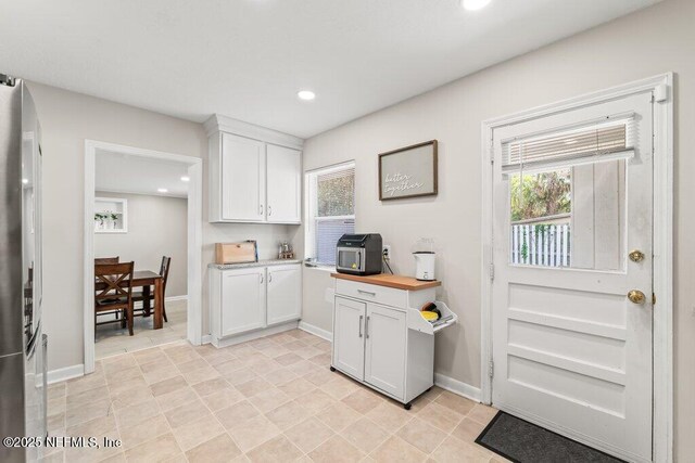 6500 Altama Rd, Jacksonville, FL 32216 - kitchen featuring white cabinets, recessed lighting, and baseboards