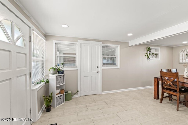 6500 Altama Rd, Jacksonville, FL 32216 - entryway with crown molding, plenty of natural light, baseboards, and recessed lighting