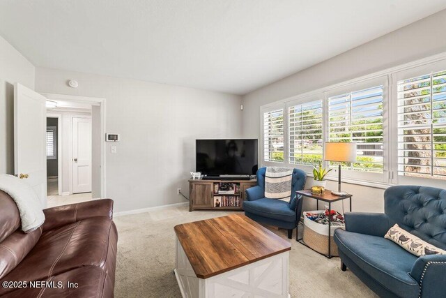 6500 Altama Rd, Jacksonville, FL 32216 - living room featuring light carpet and baseboards