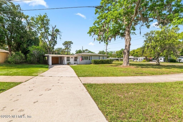 6500 Altama Rd, Jacksonville, FL 32216 - ranch-style house featuring a front yard, driveway, and a carport