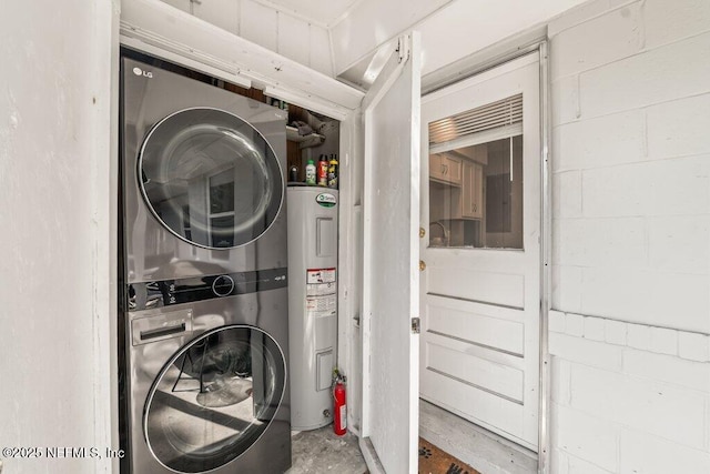 6500 Altama Rd, Jacksonville, FL 32216 - washroom with stacked washer / dryer, water heater, and concrete block wall