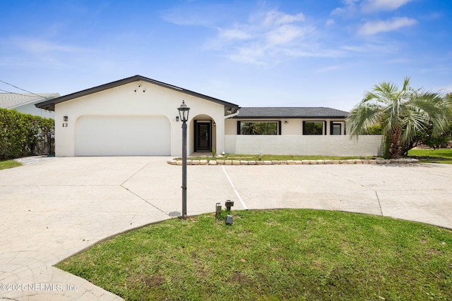 13 Clarendon Ct S, Palm Coast, FL 32137 - view of front of property with stucco siding, concrete driveway, an attached garage, and a front lawn