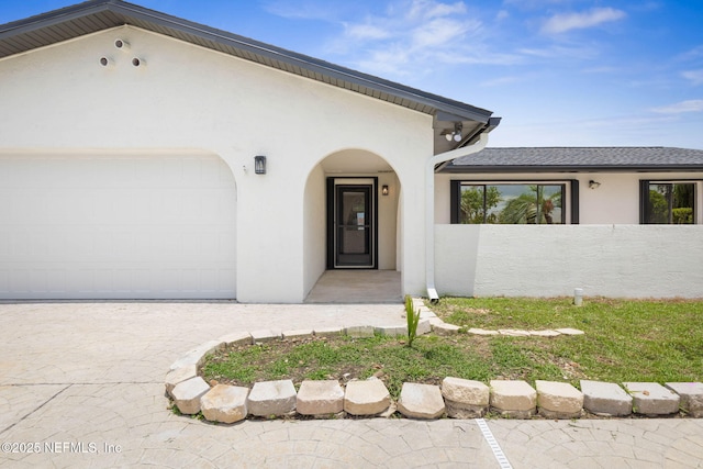 13 Clarendon Ct S, Palm Coast, FL 32137 - property entrance with stucco siding