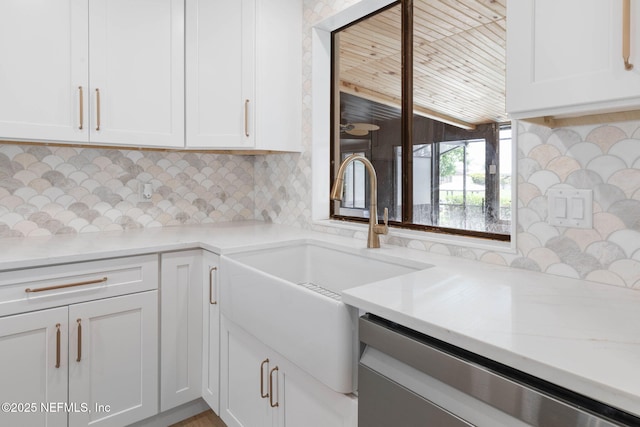 13 Clarendon Ct S, Palm Coast, FL 32137 - kitchen featuring a sink, white cabinets, and backsplash