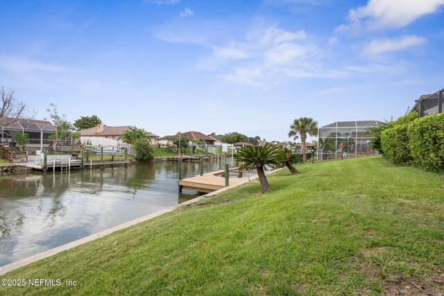 13 Clarendon Ct S, Palm Coast, FL 32137 - dock area with a yard, a water view, a residential view, and a lanai