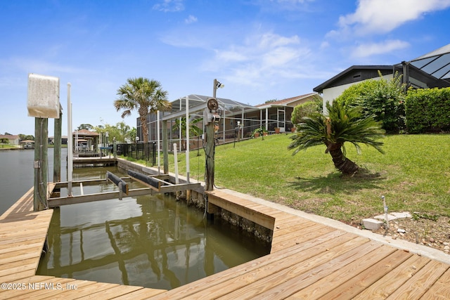 13 Clarendon Ct S, Palm Coast, FL 32137 - dock area with boat lift, glass enclosure, a yard, and a water view