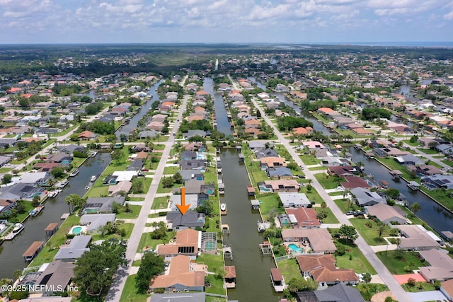 13 Clarendon Ct S, Palm Coast, FL 32137 - aerial view of property and surrounding area featuring nearby suburban area and a large body of water