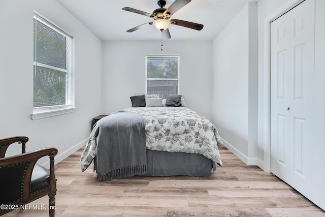 159 Twine St, Saint Augustine, FL 32084 - bedroom with light wood-style floors, a closet, a ceiling fan, and baseboards