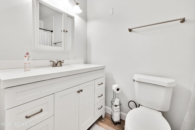 159 Twine St, Saint Augustine, FL 32084 - full bath featuring vanity, toilet, wood finished floors, and baseboards