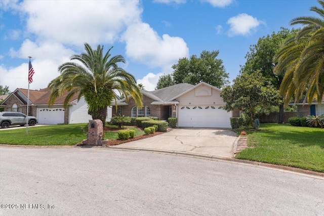 1275 Pirates Cove Ln, Fleming Island, FL 32003 - view of front facade with a garage, concrete driveway, and brick siding
