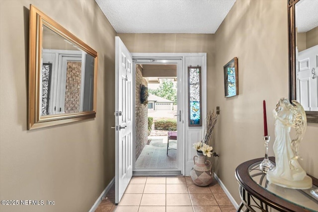 1275 Pirates Cove Ln, Fleming Island, FL 32003 - foyer featuring baseboards, a textured ceiling, and light tile patterned floors