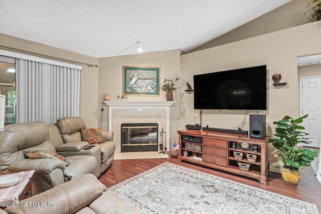 1275 Pirates Cove Ln, Fleming Island, FL 32003 - living room with wood finished floors, lofted ceiling, and a fireplace